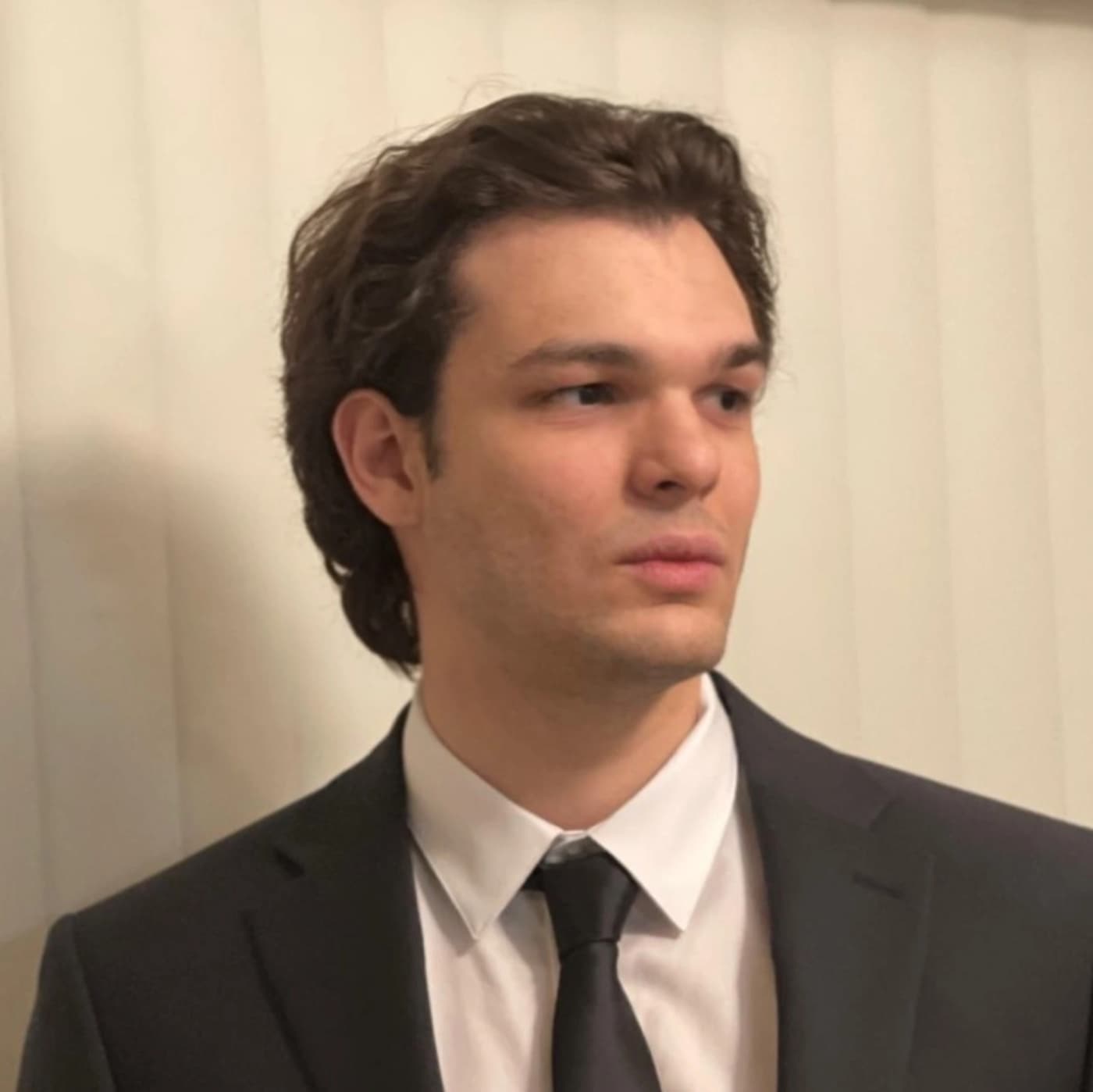 ATILAY CANDAN in a suit